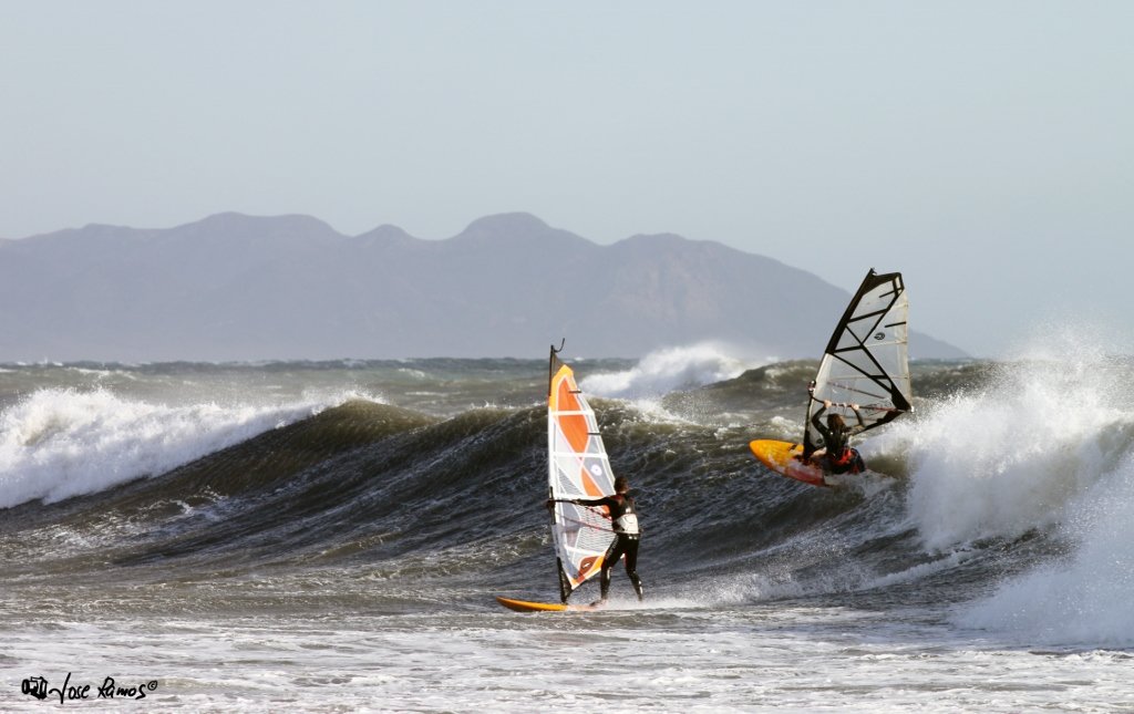 Fran Perez and Jose sharing a wave.